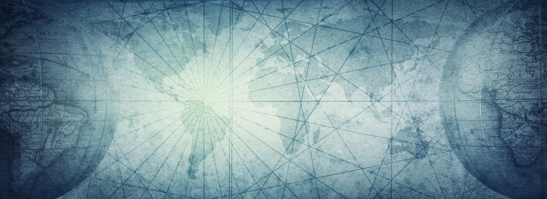 Ancient old globe on the vintage map background. Selective focus. Retro style. Science, education, travel, vintage background. History and geography team.