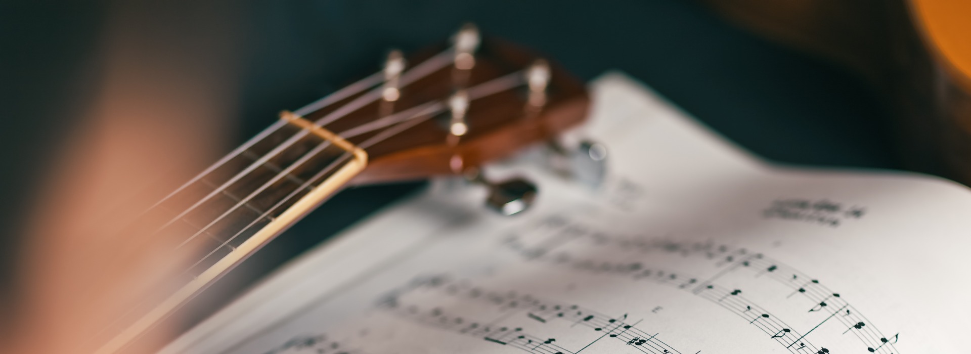 Close-up photograph of a person who studies musical score