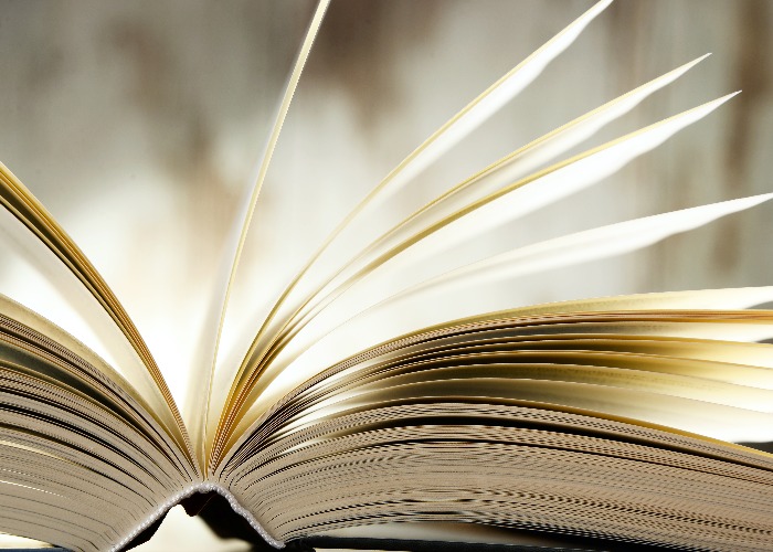 Composition with hardcover book on the table