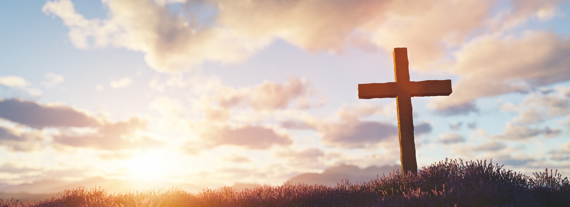 Cross at sunset religion and faith