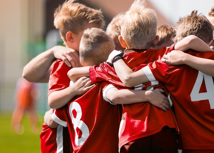 Kids Play Sports Game. Children Sporty Team United Ready to Play Game. Children Team Sport. Youth Sports For Children. Boys in Sports Jersey Red Shirts. Young Boys in Soccer Sportswear